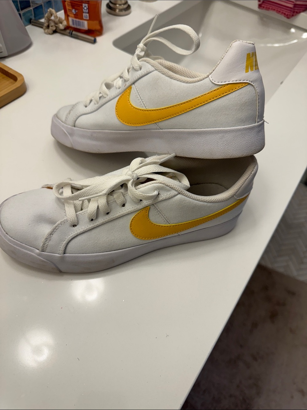 Nike White canvas Low-Top Sneakers with Yellow Swoosh